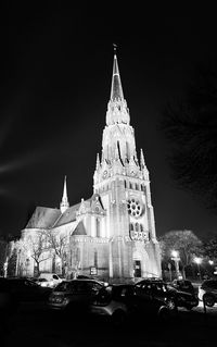 View of illuminated buildings against sky at night