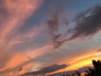 Low angle view of dramatic sky during sunset