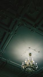 Low angle view of illuminated chandelier in building