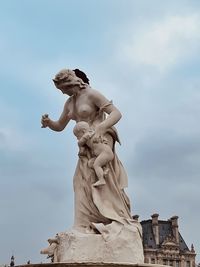 Low angle view of statue against sky