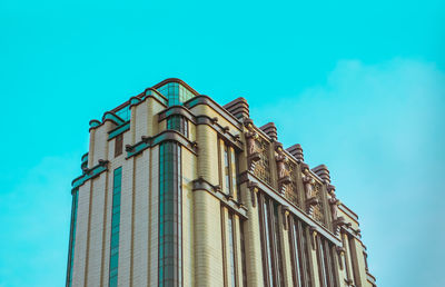 Low angle view of building against blue sky