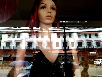 Portrait of beautiful woman in city