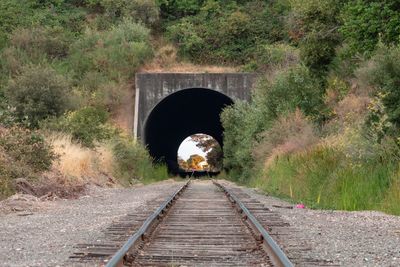Bridge over railroad tracks in tunnel