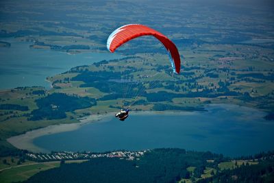 Person paragliding in sky