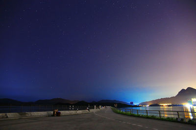 Illuminated road at night