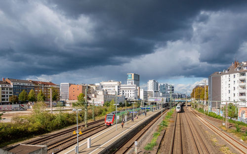 High angle view of railroad tracks in düsseldorf against cloudy sky