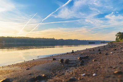 Scenic view of beach against sky during sunset