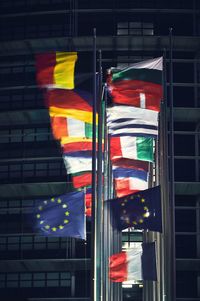 Low angle view of flag against building