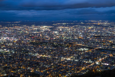 High angle view of illuminated city buildings at night