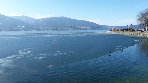 Scenic view of lake against blue sky