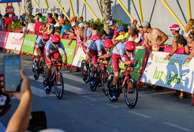 People riding bicycles on road