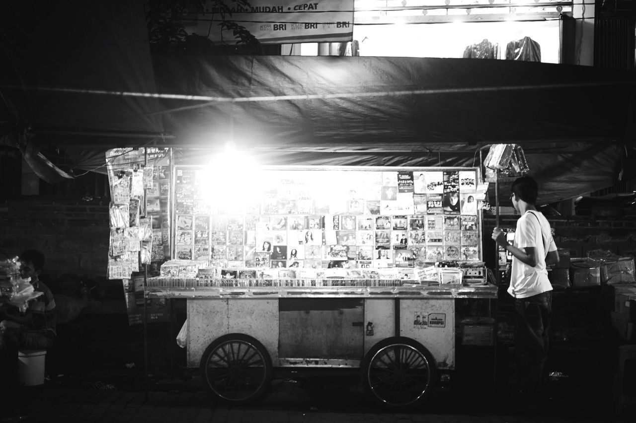 PEOPLE WORKING AT MARKET STALL