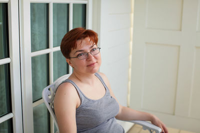 Portrait of young woman looking away