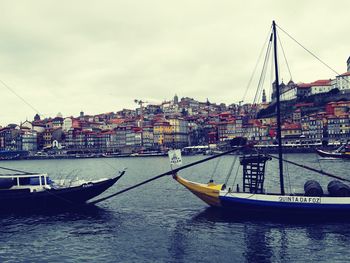 Boats moored at harbor