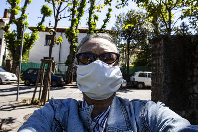 Close-up portrait of senior man wearing mask