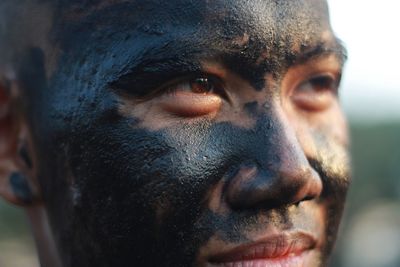 Close-up of man with dirty face