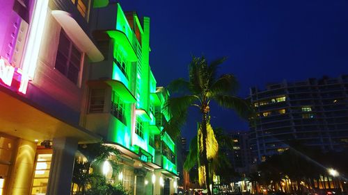 Low angle view of illuminated buildings at night