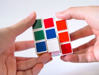 Close-up of hand holding multi colored toy