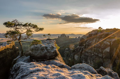 Scenic view of rocks against sky during sunset