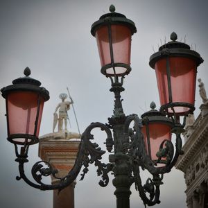 Low angle view of street light against sky