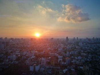 Cityscape against sky during sunset