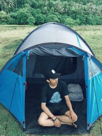 Man sitting in tent