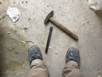 Low section of man standing on floor