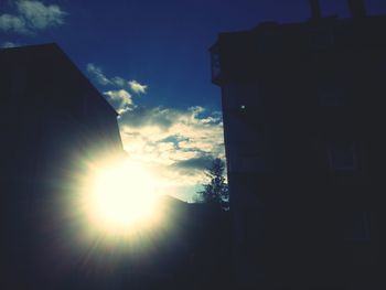 Low angle view of building against sky at sunset