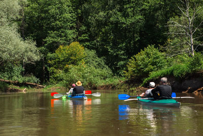 People kayaking in lake