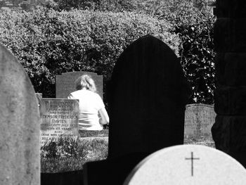 Rear view of man and woman looking at camera