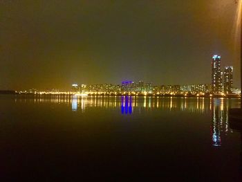 Reflection of illuminated buildings in water