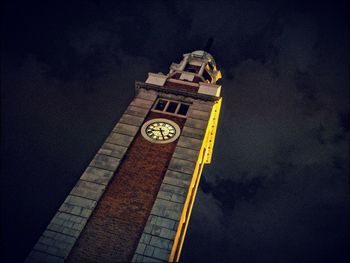 Low angle view of clock tower against sky