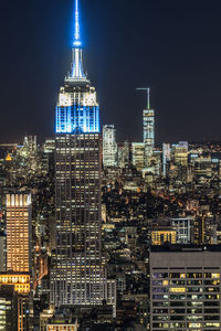 Illuminated buildings in city at night