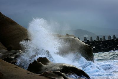 Waves splashing on rocks