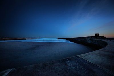 Scenic view of sea against clear blue sky