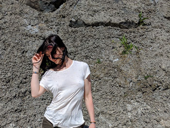 High angle view of smiling young woman standing outdoors