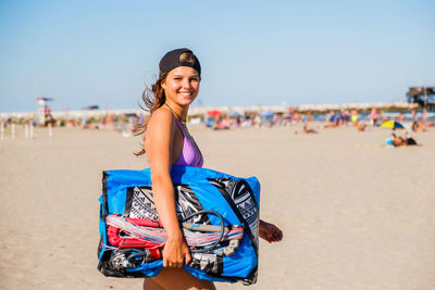 Young woman standing at beach