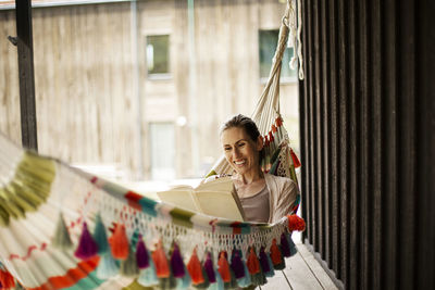 Woman reading on hammock