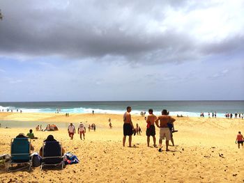 GROUP OF PEOPLE ON BEACH