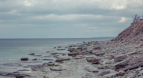 View of calm beach against sky