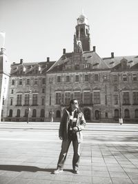 Woman standing on city street