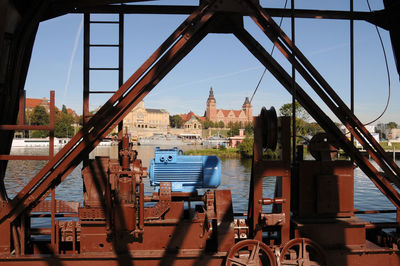 View of bridge and buildings against sky