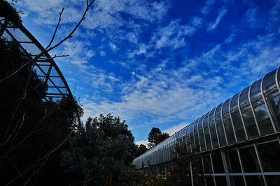 Low angle view of building against cloudy sky