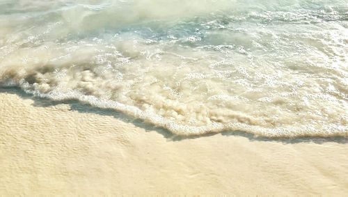 High angle view of surf on beach