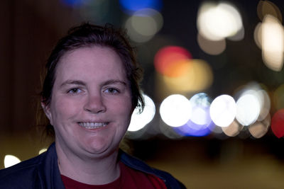 Close-up portrait of smiling young woman