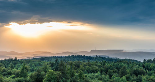 Scenic view of mountains against sky at sunset