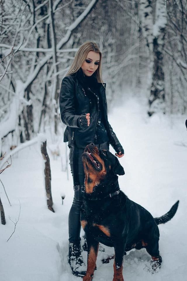WOMAN WITH DOG ON SNOW