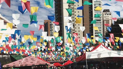 Low angle view of multi colored flags hanging