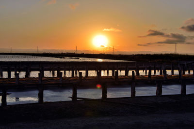 Scenic view of beach against sky during sunset