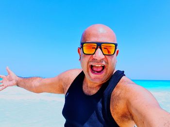 Portrait of man against sea against clear sky